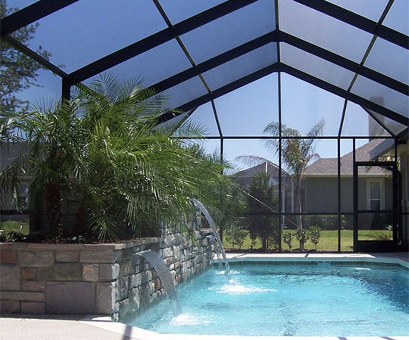 A lanai enclosure renovation in progress, with workers updating the screens and frames