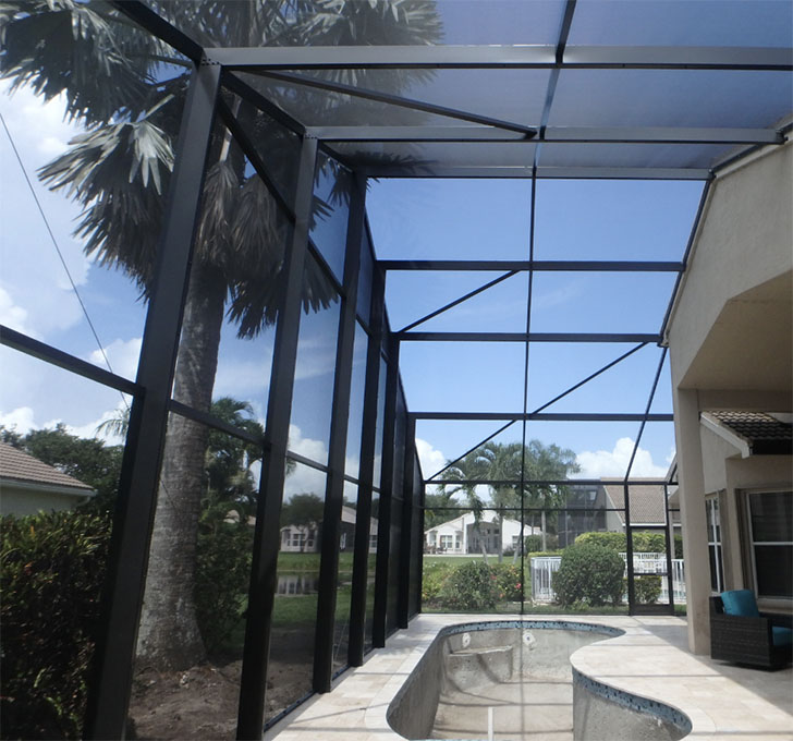 A photo of a beautiful lanai enclosure installation with a view of the surrounding landscape