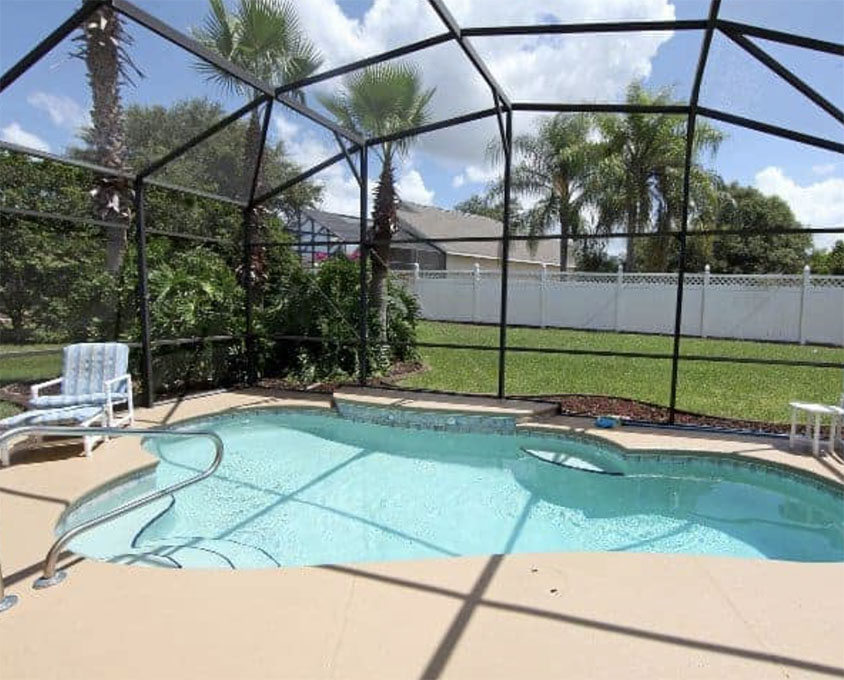 An overhead view of an aluminum porch enclosure with a view of the surrounding landscape